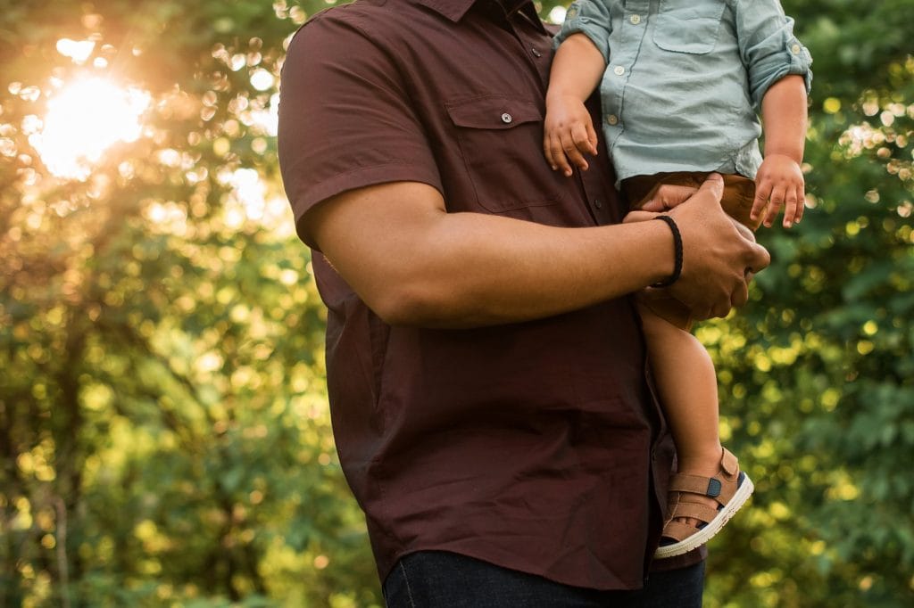 Family Photographer Perrysburg Ohio close up of dad holding toddler photo by Cynthia Dawson Photography