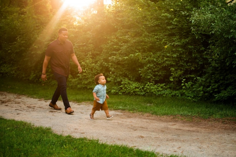 Family Photographer Perrysburg Ohio dad chasing toddler photo by Cynthia Dawson Photography