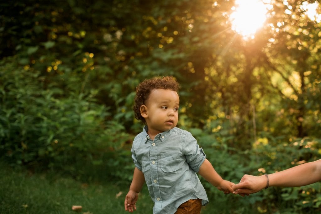 Family Photographer Perrysburg Ohio son holding moms's finger photo by Cynthia Dawson Photography