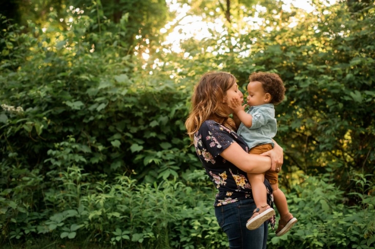 Family Photographer Perrysburg Ohio toddler boy giving mom a kiss photo by Cynthia Dawson Photography