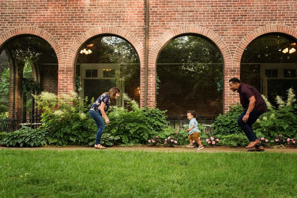 Family Photographer Perrysburg Ohio family of 3 chasing each other photo by Cynthia Dawson Photography