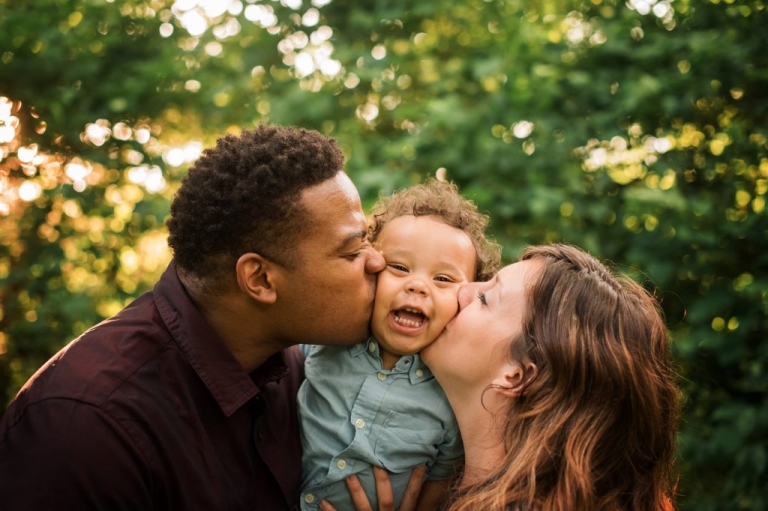 Family Photographer Perrysburg Ohio family of 3 kissing photo by Cynthia Dawson Photography