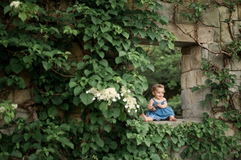 Toledo Ohio Child Photographer baby girl sitting on stone wall photo by Cynthia Dawson Photography