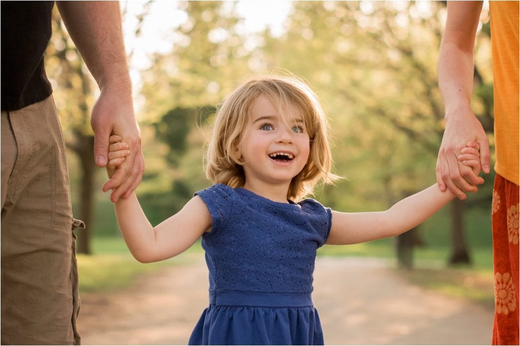 Northwest Ohio Family Lifestyle Photographer close up of girl holding parents handsphoto by Cynthia Dawson Photography