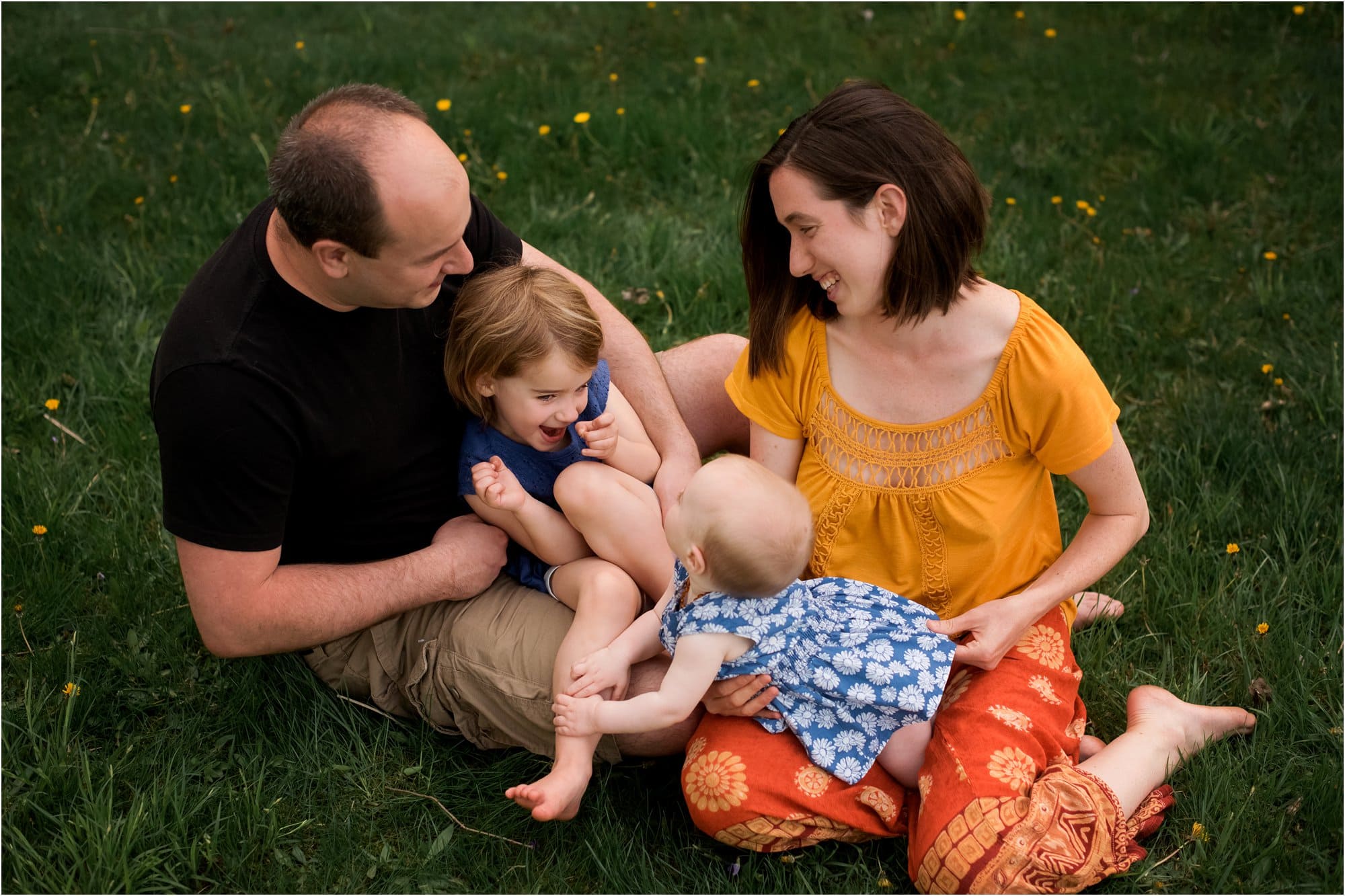 Northwest Ohio Family Lifestyle Photographer family of four embracing photo by Cynthia Dawson Photography