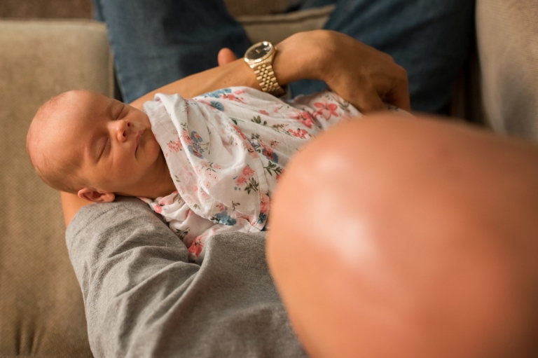 Newborn Photos in Toledo Ohio dad holding baby girl photo by Cynthia Dawson Photography