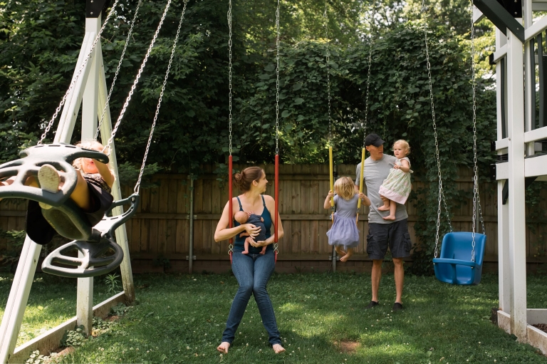Newborn Family Photographer Toledo family on swing set photo by Cynthia Dawson Photography