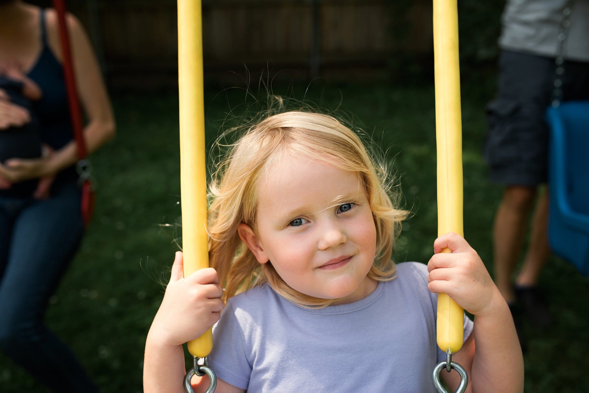 Newborn Family Photographer Toledo portrait of child on swing photo by Cynthia Dawson Photography