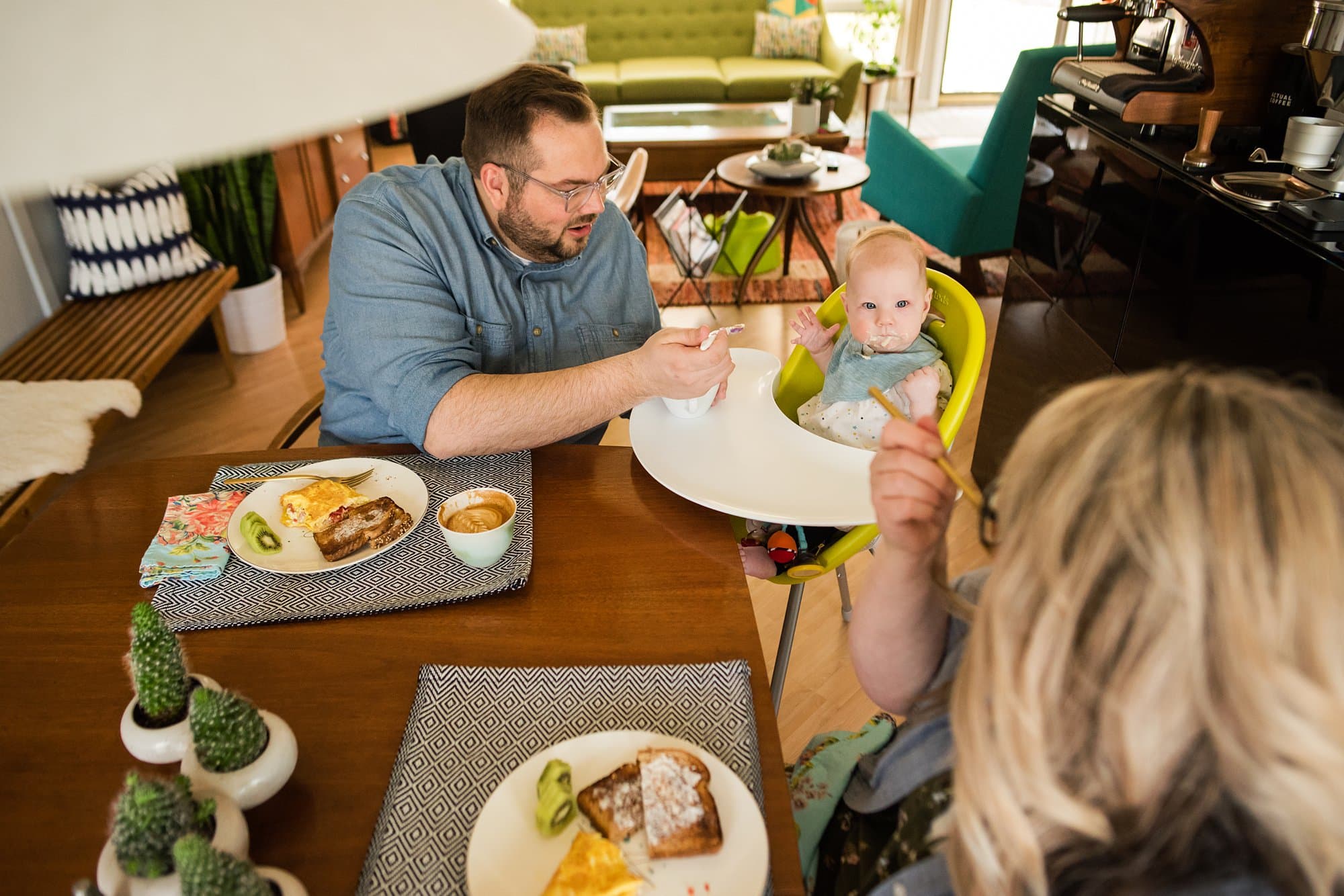 Lifestyle Photographer in Perrysburg Ohio mom looking at baby photo by Cynthia Dawson Photography 