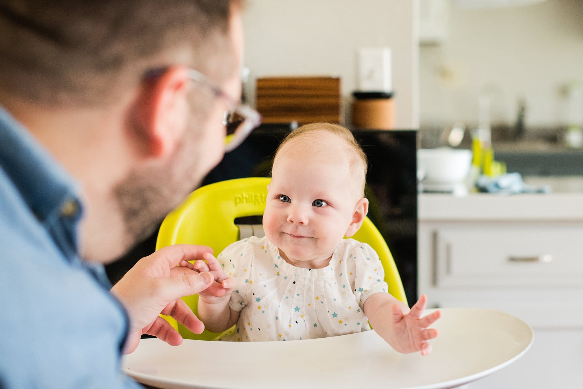 Lifestyle Photographer in Toledo  Ohio mom looking at baby photo by Cynthia Dawson Photography 