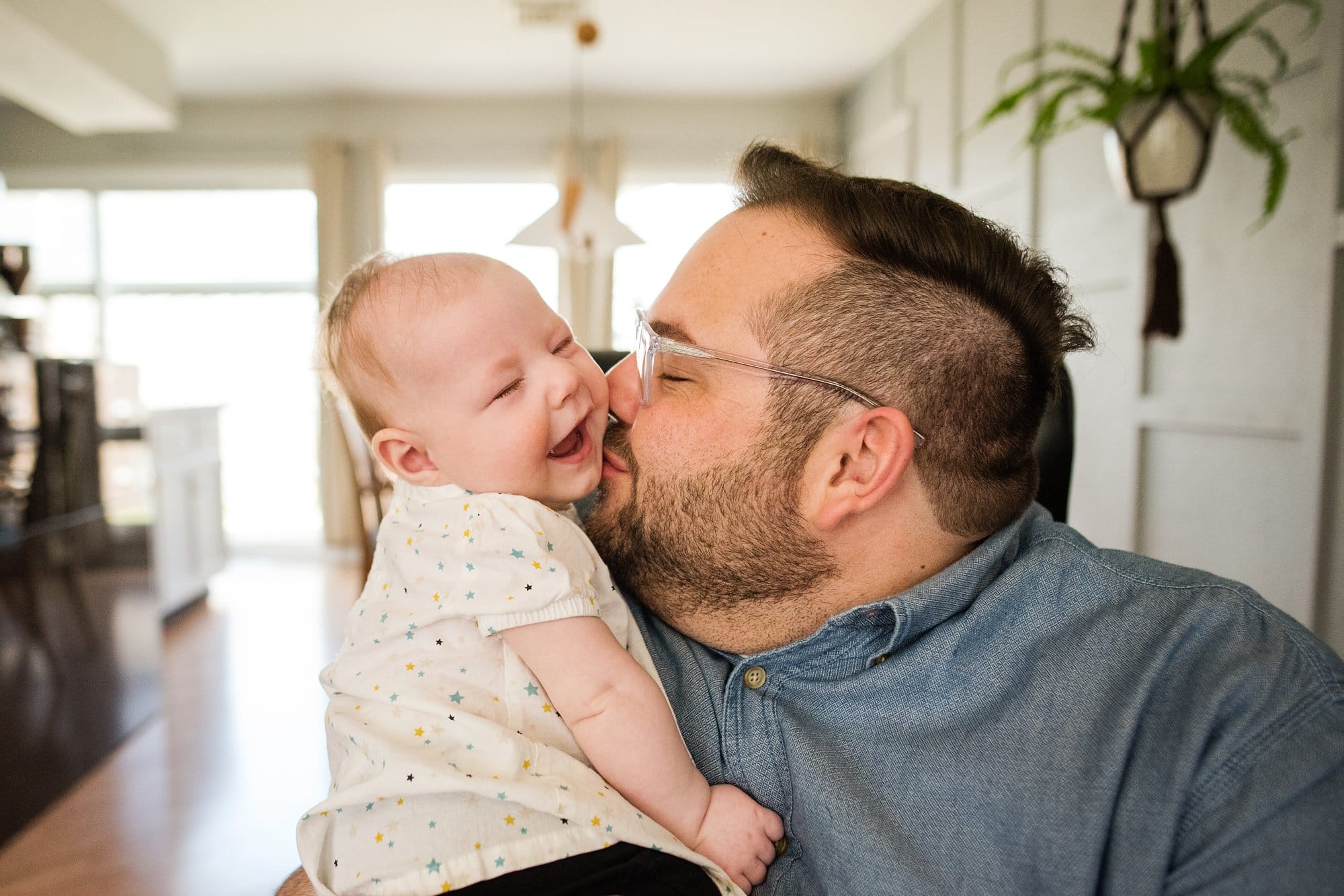 Toledo Ohio Family Photographer mom looking at baby photo by Cynthia Dawson Photography 