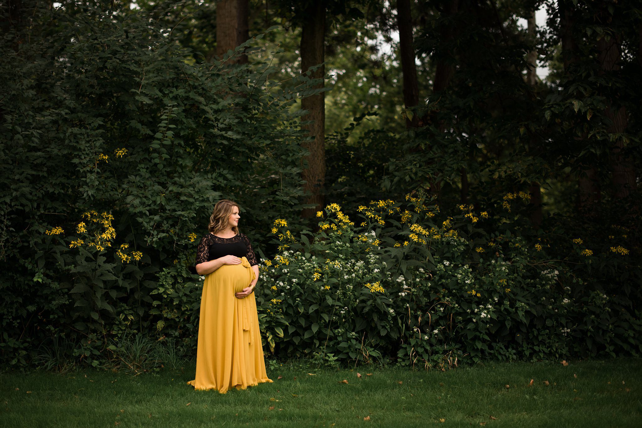 Maumee Ohio Maternity Photographer mother holding belly photo by Cynthia Dawson Photography 