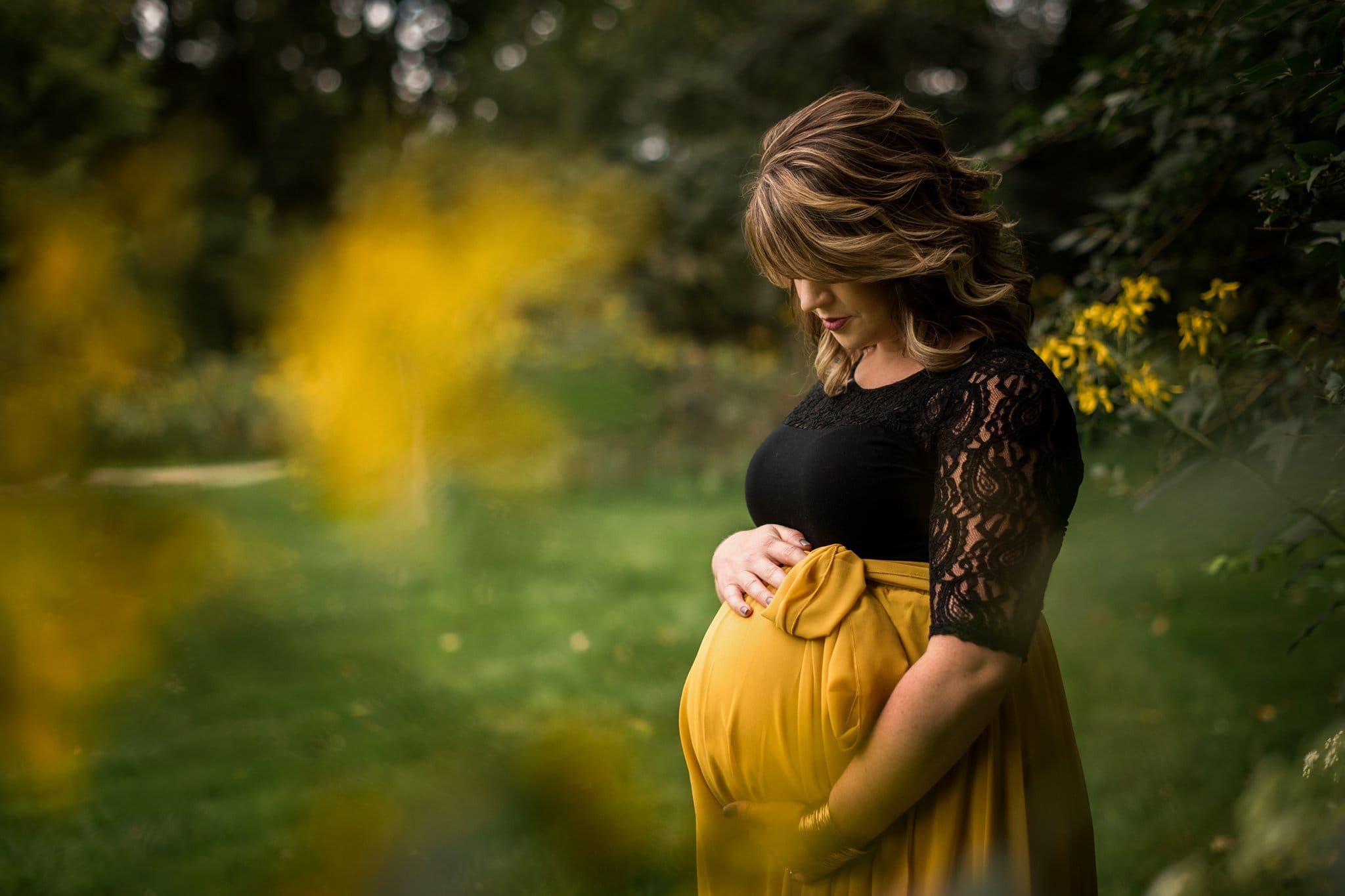 Maumee Ohio Maternity Photographer mother holding belly photo by Cynthia Dawson Photography 