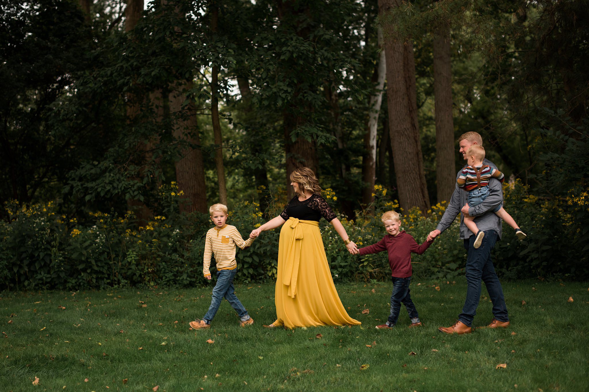 Maumee Ohio Maternity Photographer family walking together photo by Cynthia Dawson Photography 