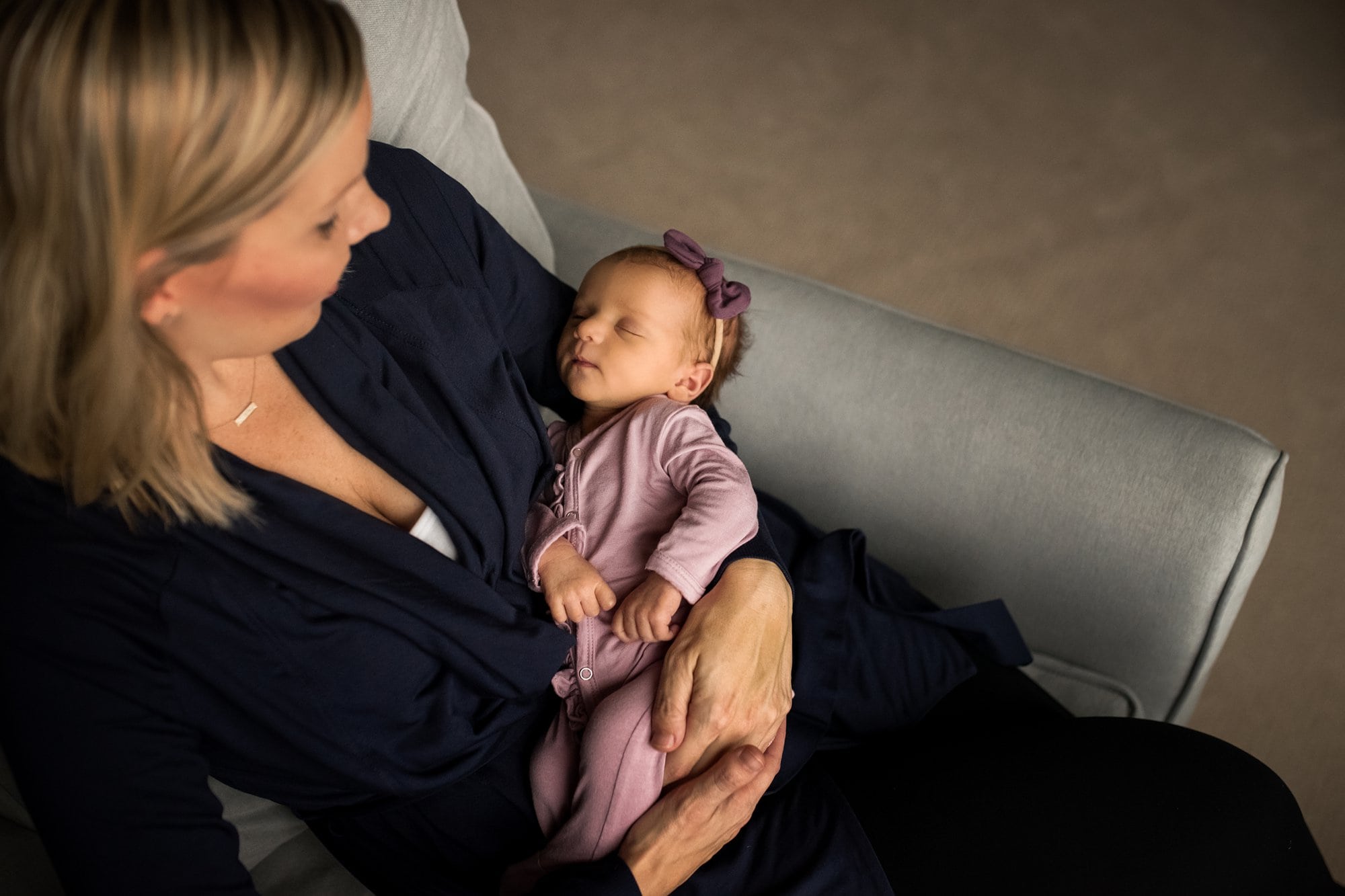 Newborn Lifestyle Photography in Perrysburg mother holding baby photo by Cynthia Dawson Photography