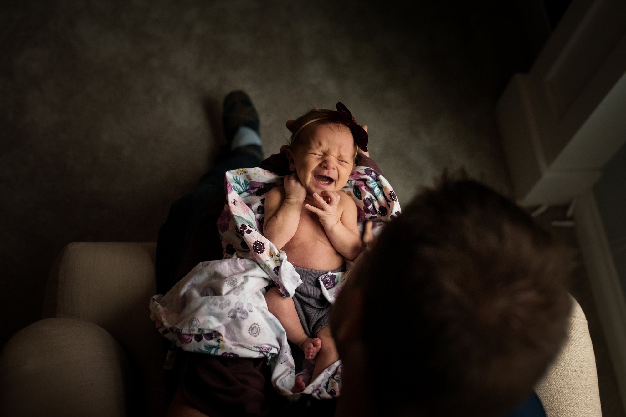 Newborn Lifestyle Photography in Perrysburg mother holding baby photo by Cynthia Dawson Photography