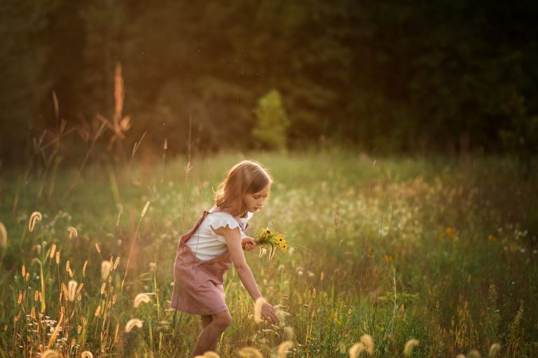 Toledo Family Photographer photo of little girl picking flowers by cynthia dawson photography 