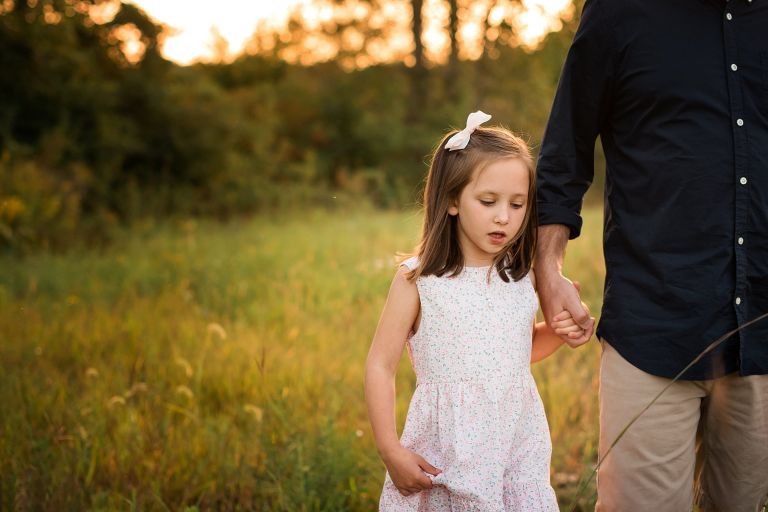 family photographer in toledo ohio little girl holding dad's hand photo by cynthia dawson photography 