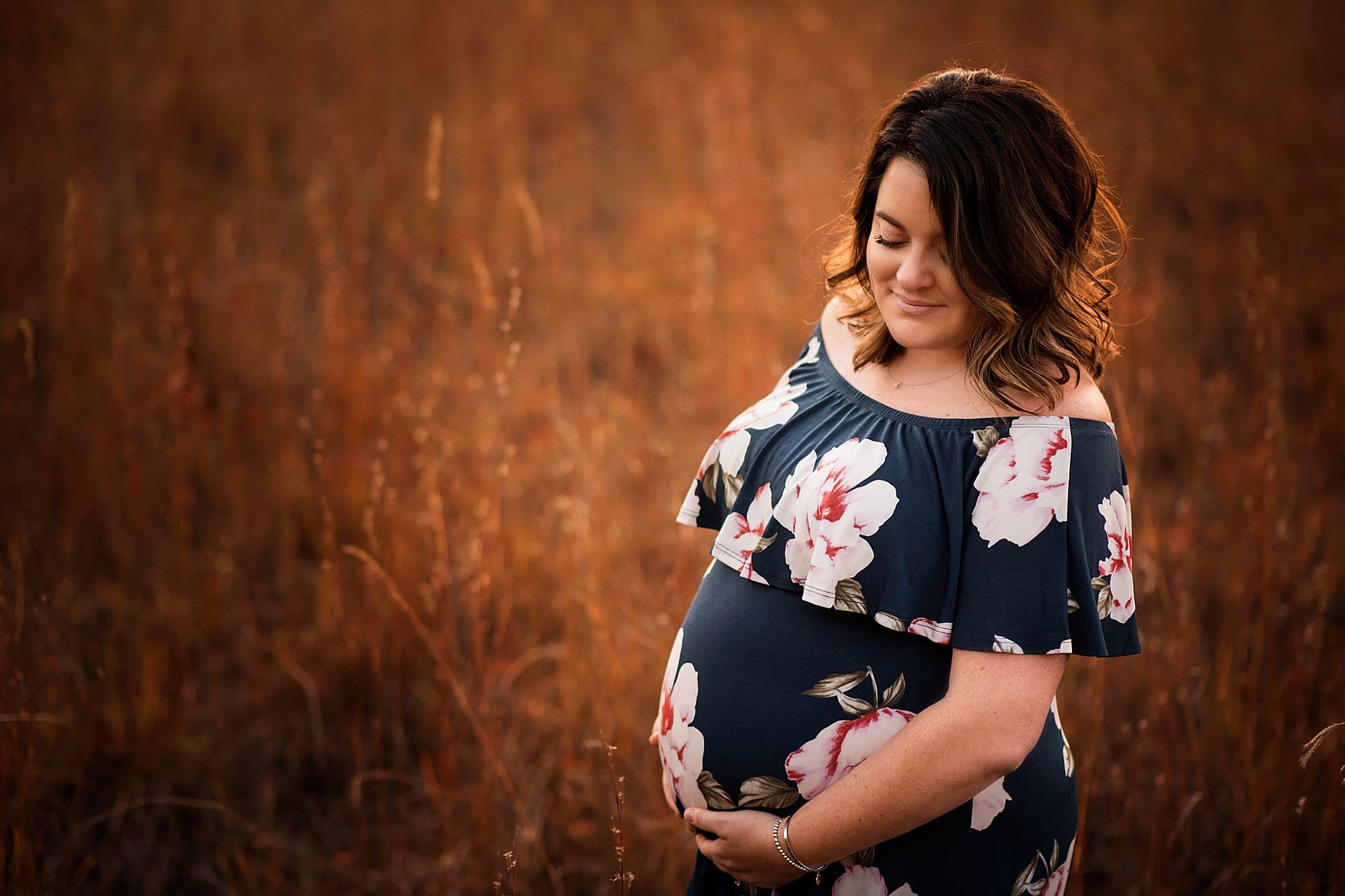 Toledo Maternity Photographer pregnany woman holding belly photo by cynthia dawson photography 