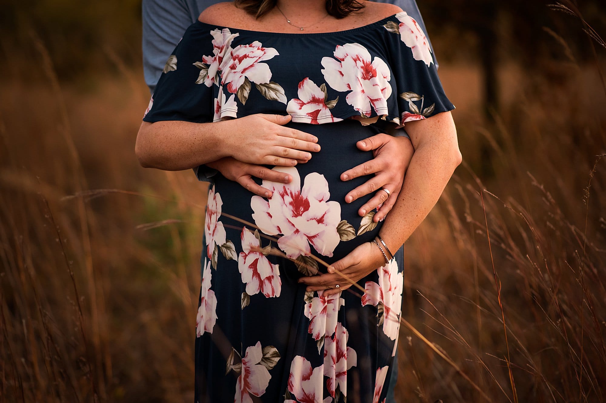 Toledo Maternity Photographer man holding pregnant wife's stomach photo by cynthia dawson photography 