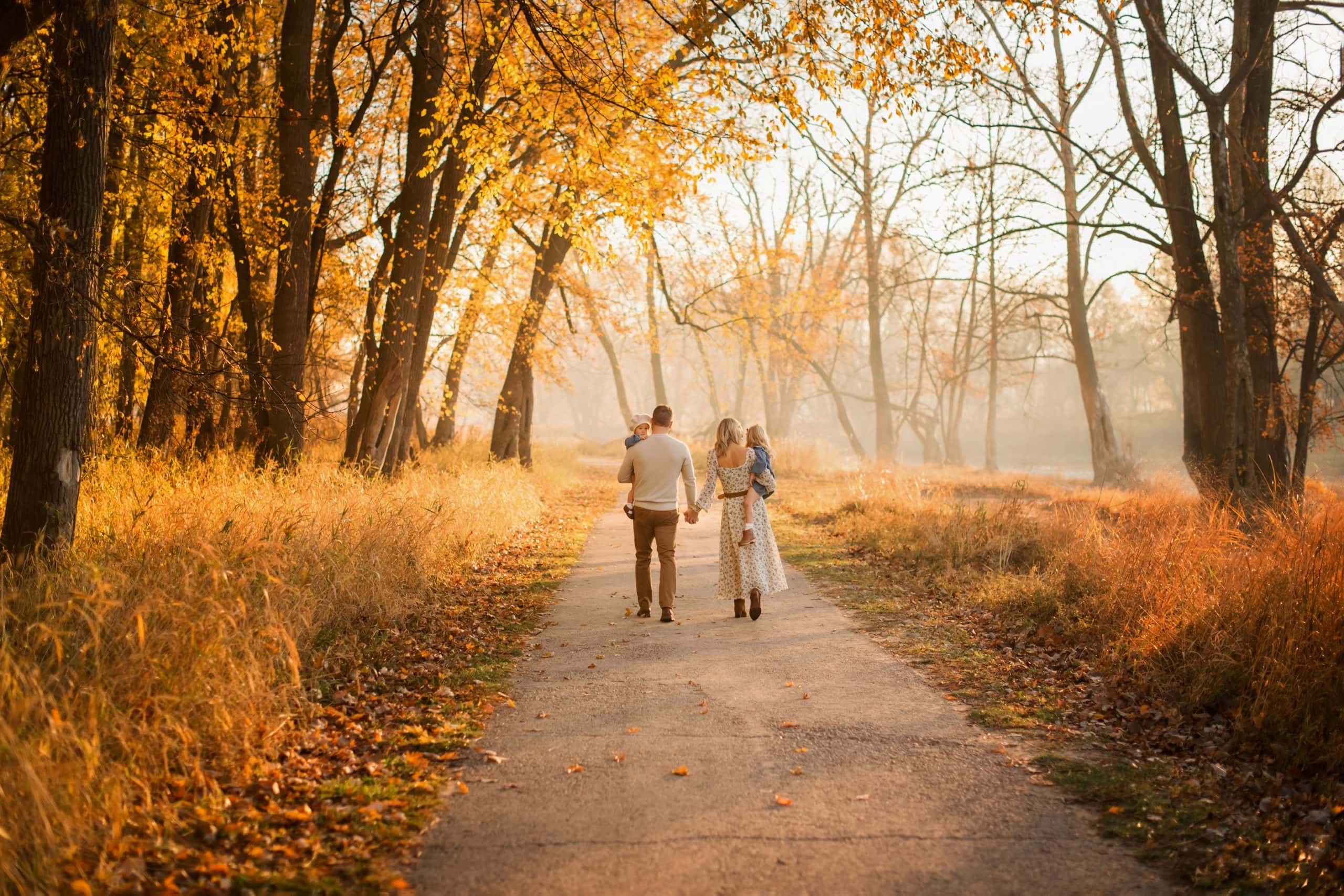 Toledo Photographer family of 4 walking in foggy sunrise photo by Cynthia Dawson Photography