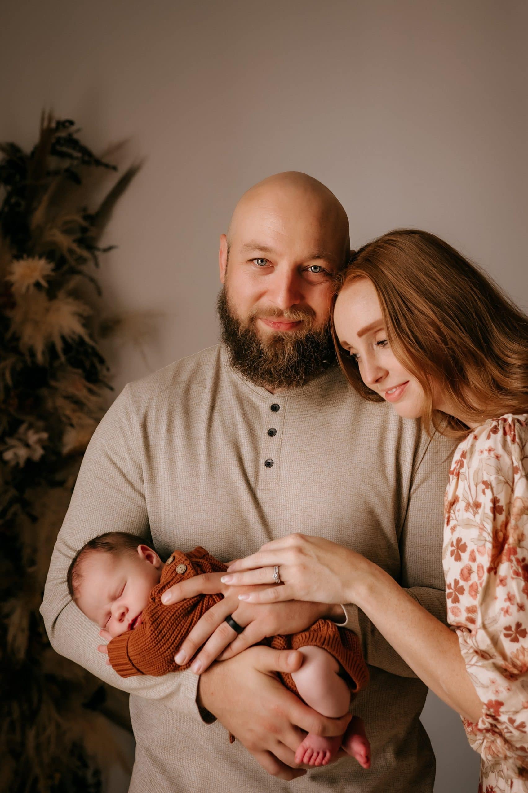 downtown toledo photo studio newborn with parents 